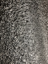 Close-up of shiny hot stamping foil being applied to a product surface.