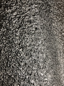 Close-up of shiny hot stamping foil being applied to a product surface.