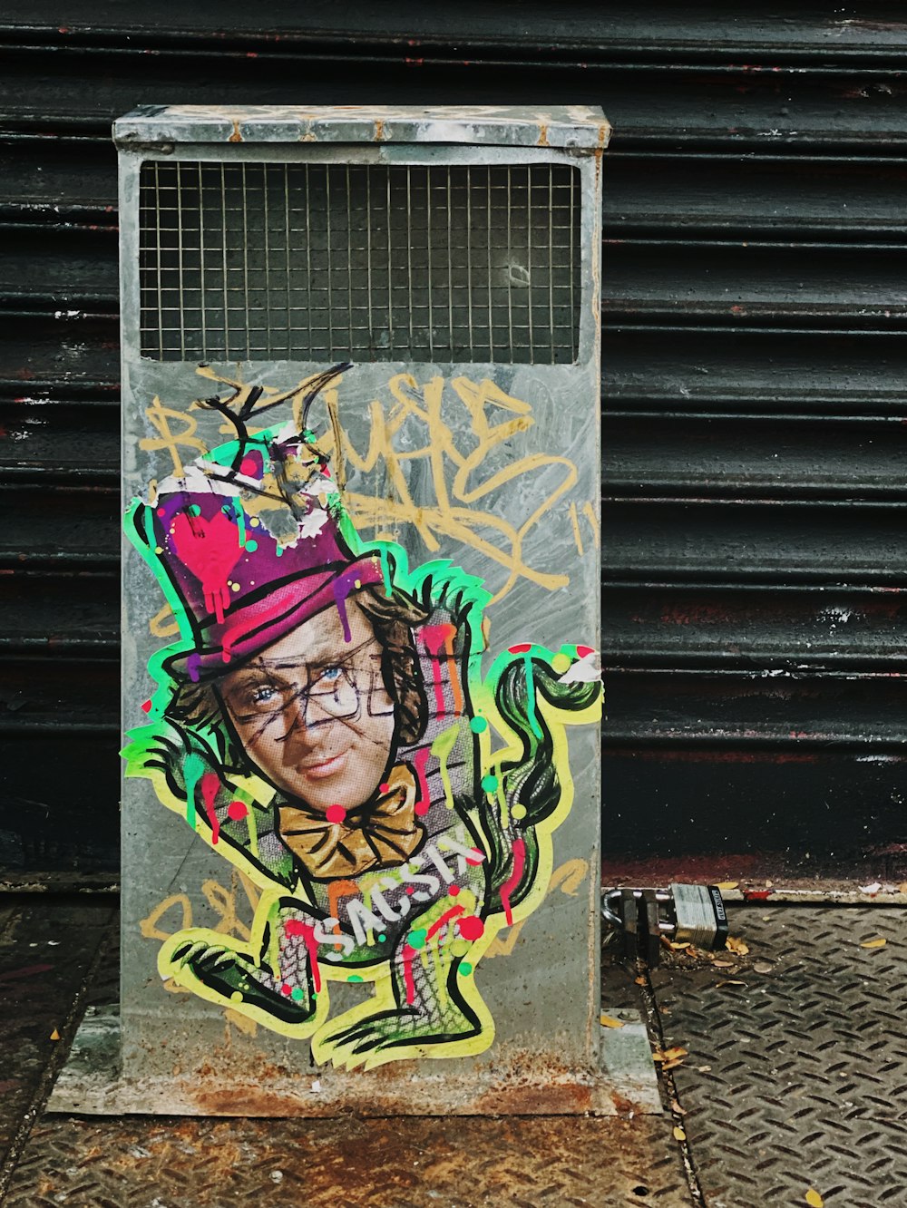 man wearing purple hat graffiti during daytime