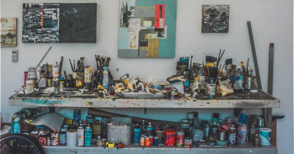 landscape photography of painting mediums on workbench