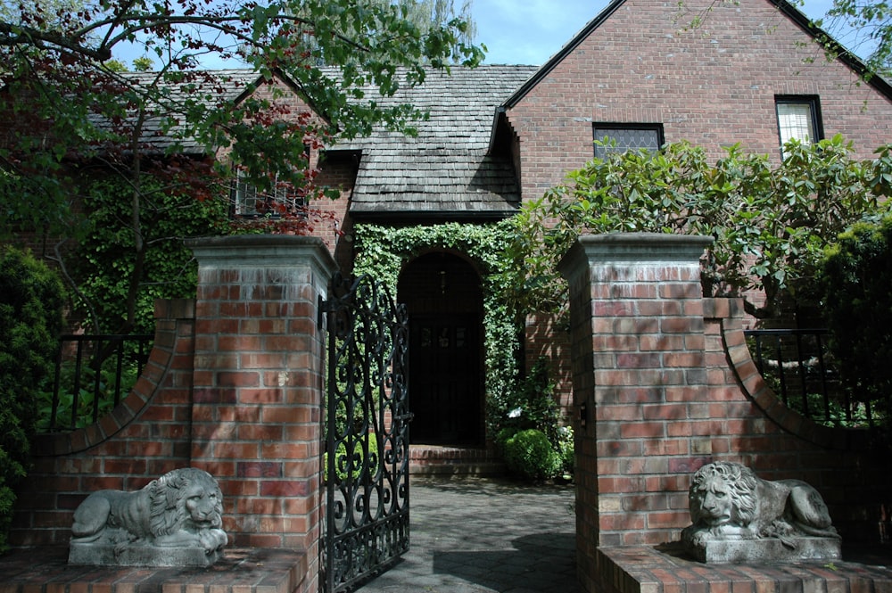 an open gate leading to the house