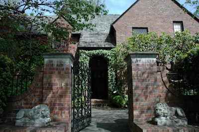 an open gate leading to the house vanguard zoom background