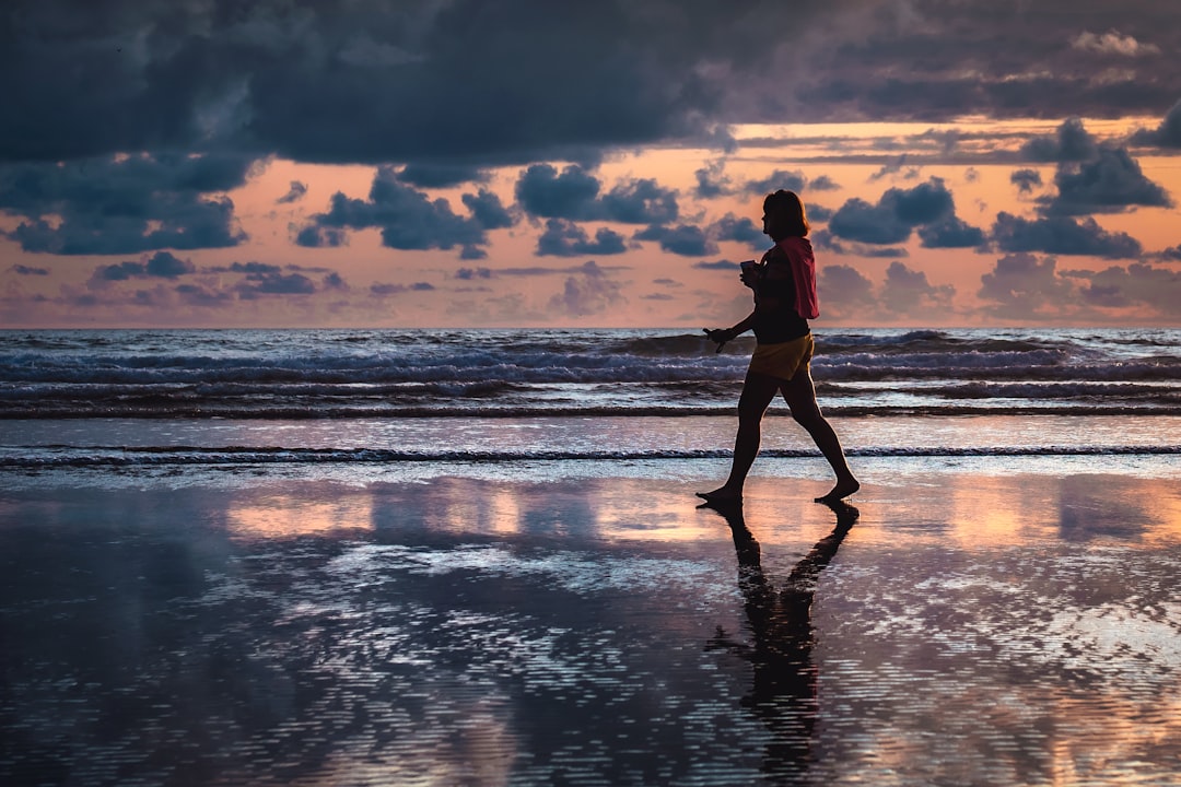 woman walking along the seashore