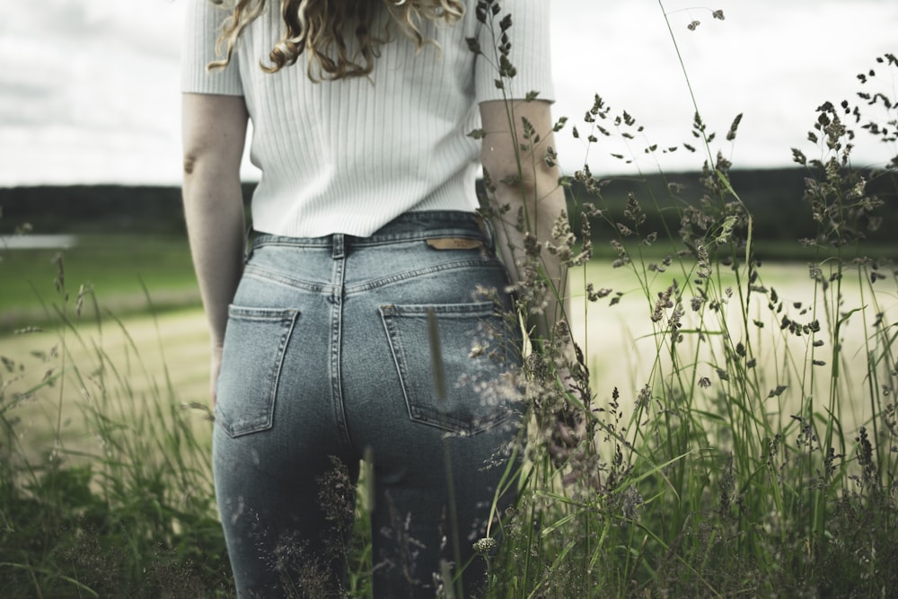 woman standing on green field