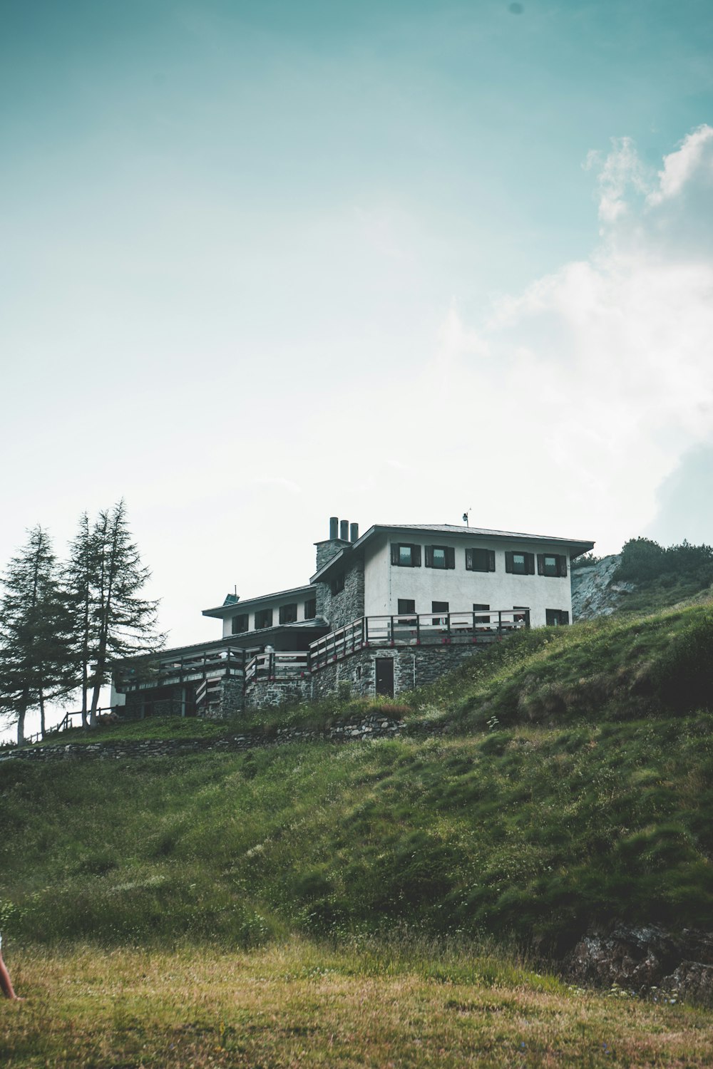 white concrete house under a calm blue sky