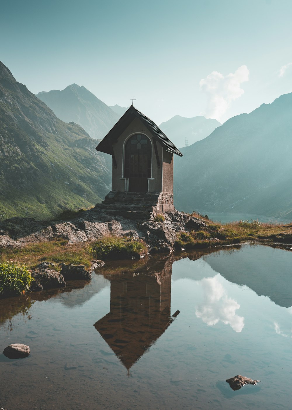 brown house near body of water