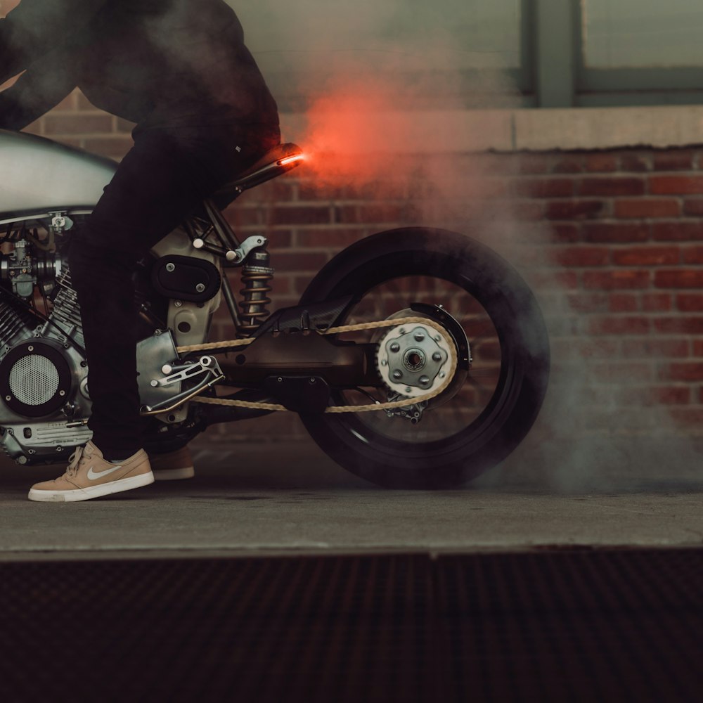 man riding on white motorcycle