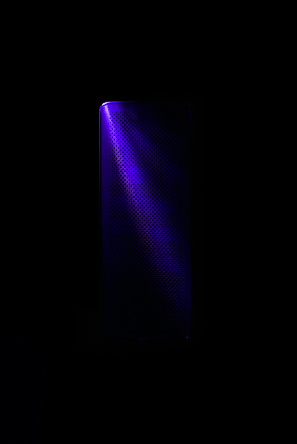 Vertical bluetooth speaker on a black background