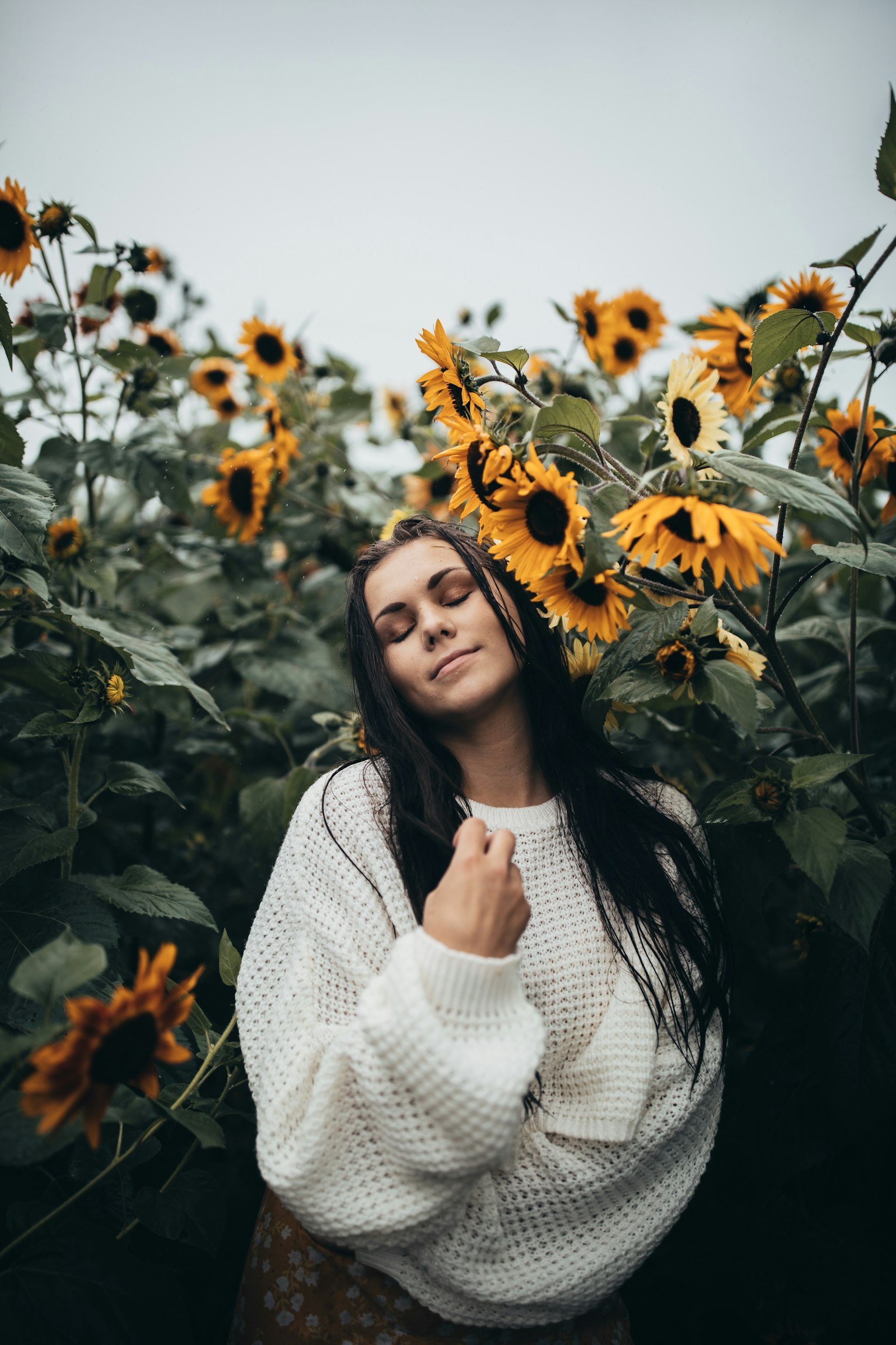 Canon EOS 5D Mark III + Canon EF 35mm F1.4L II USM sample photo. Woman standing beside sunflowers photography