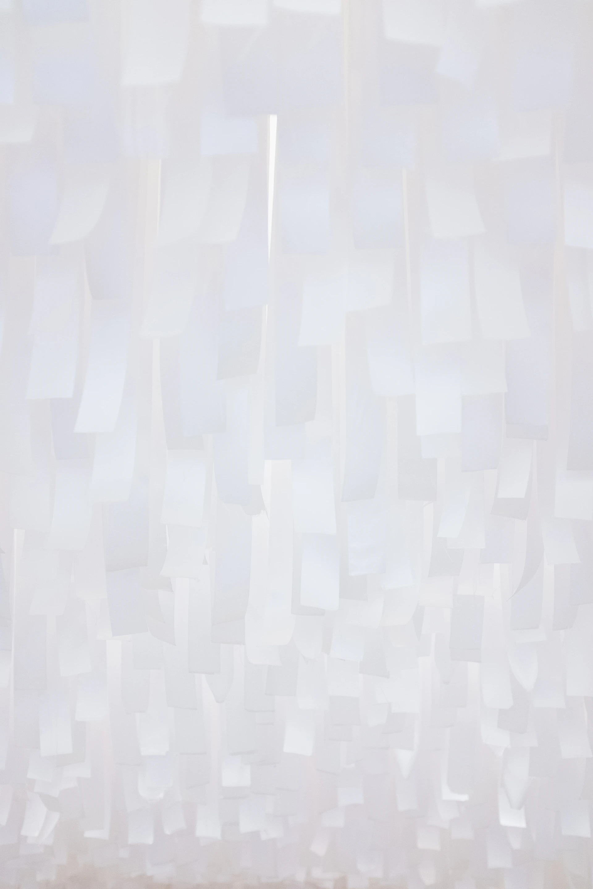 a white wall with a bunch of white squares on it