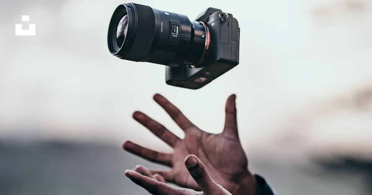 Man wearing blue dress shirt catching black DSLR camera photo – Free ...