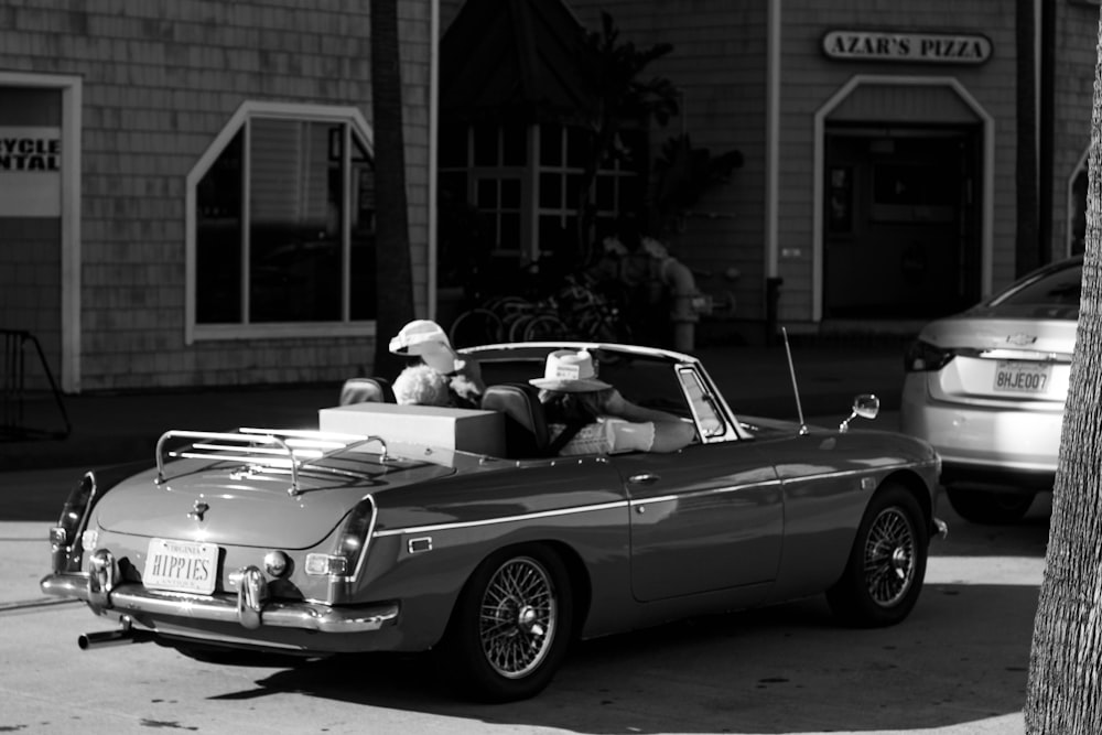 grayscale photo of classic convertible coupe