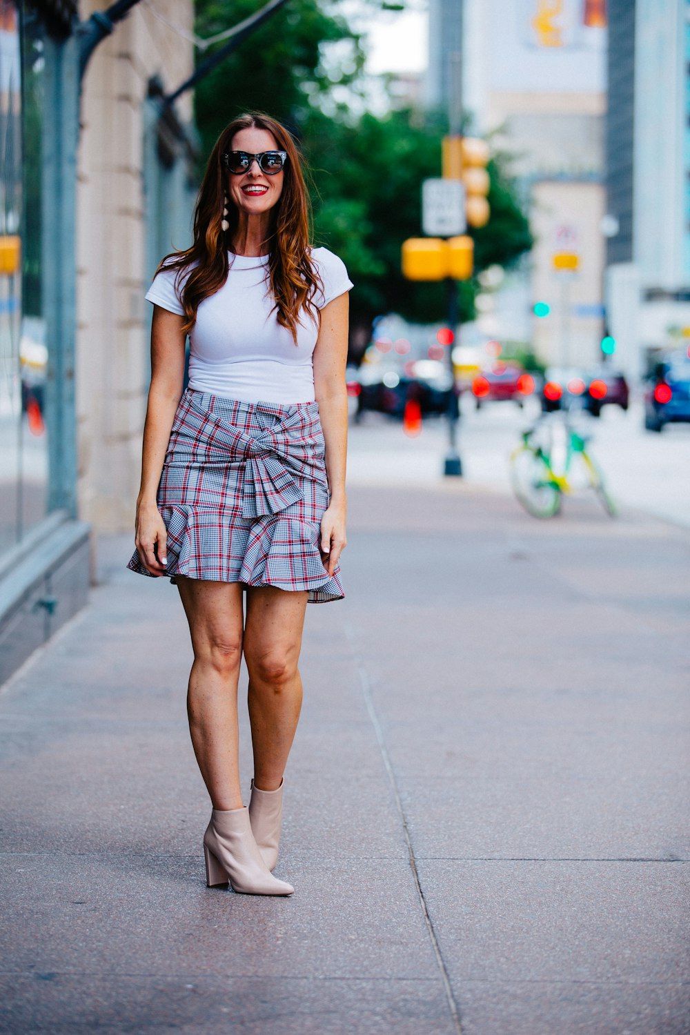 woman standing on sidewalk