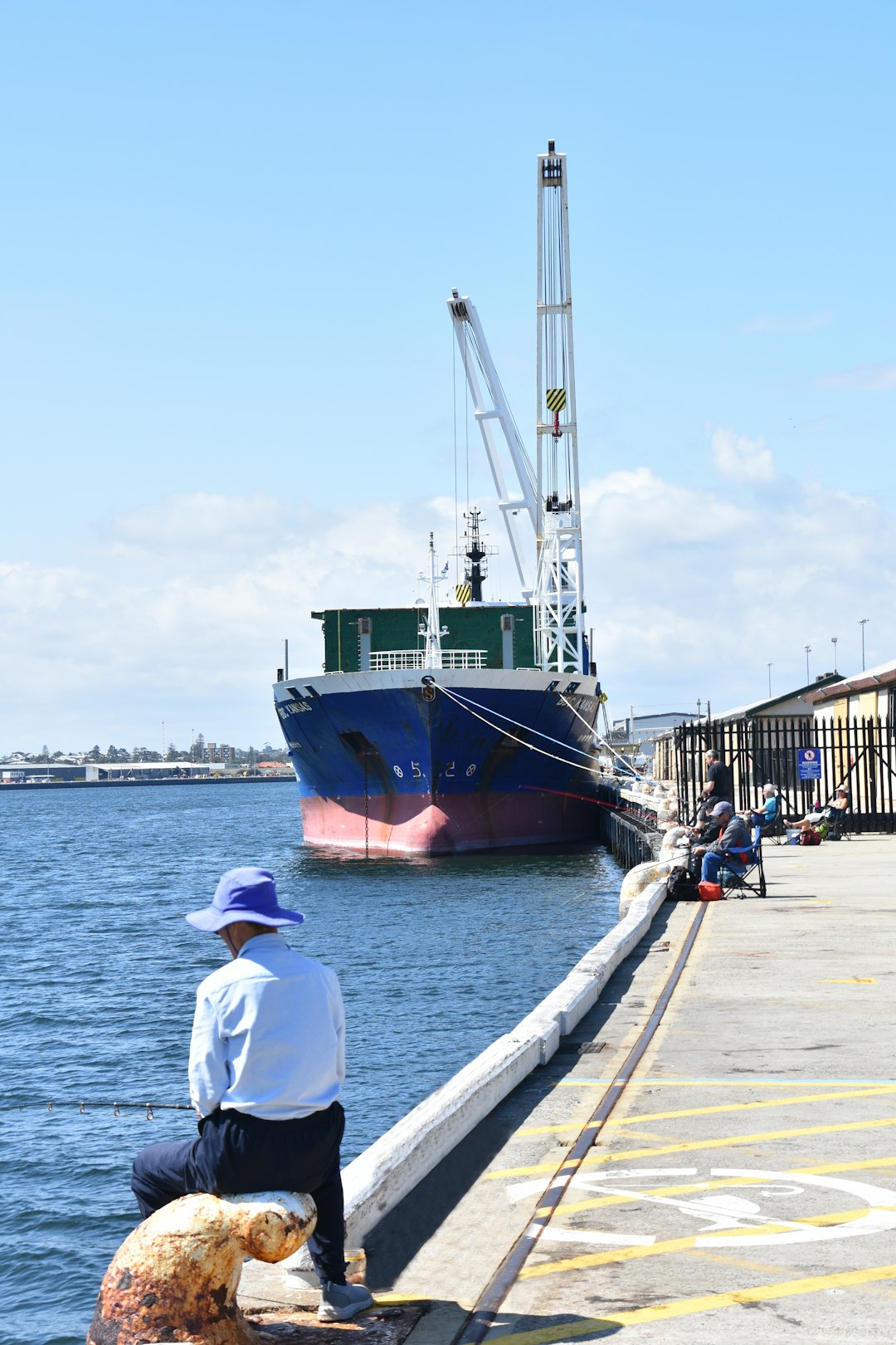 blue and white ship in body of water during daytime