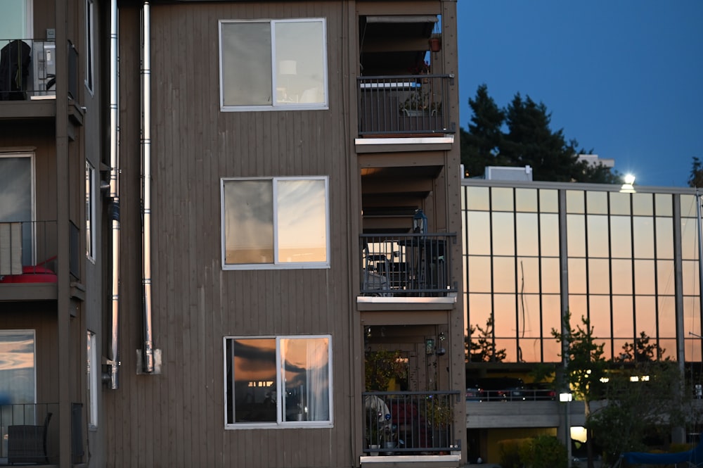 brown wooden house beside plant