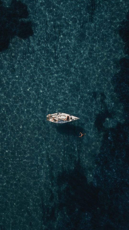 bird's-eye view of white boat on body of water in Elba Italy