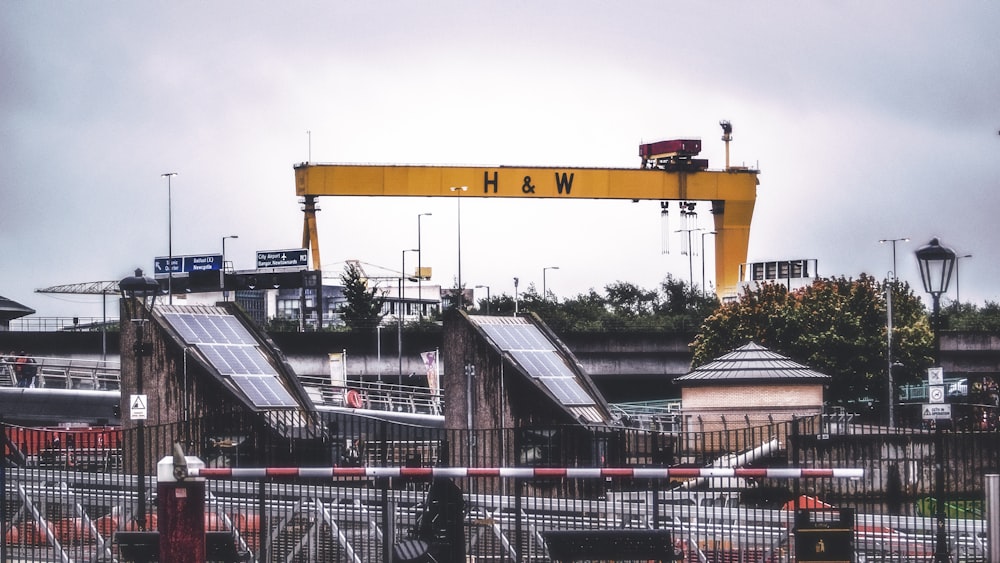 yellow H&W tower during daytime photo