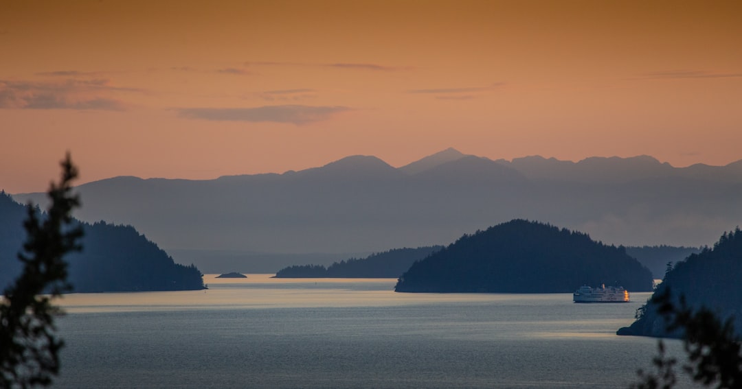 ship near isles during day, Howe Sound in British Columbia