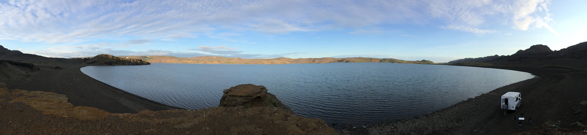 woman wearing yellow long-sleeved dress under white clouds and blue sky during daytime