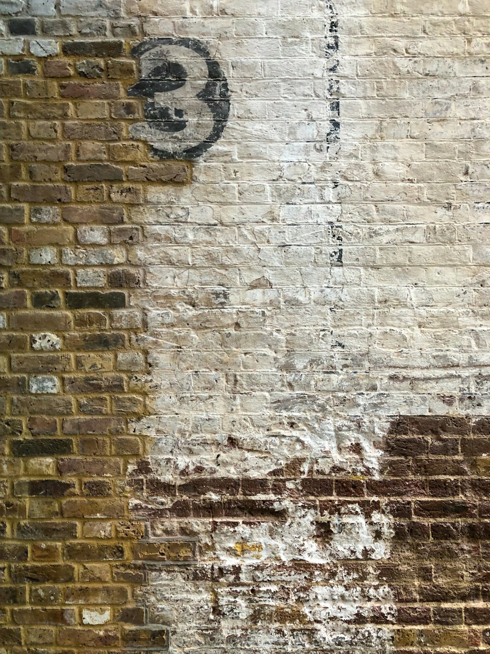 a red fire hydrant sitting next to a brick wall