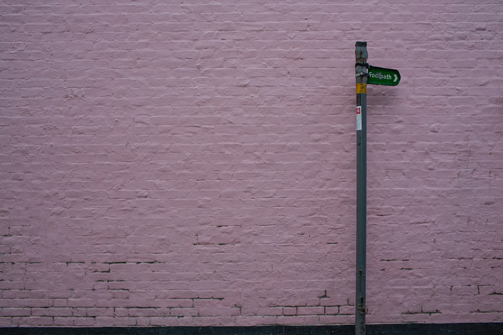 green and grey street sign