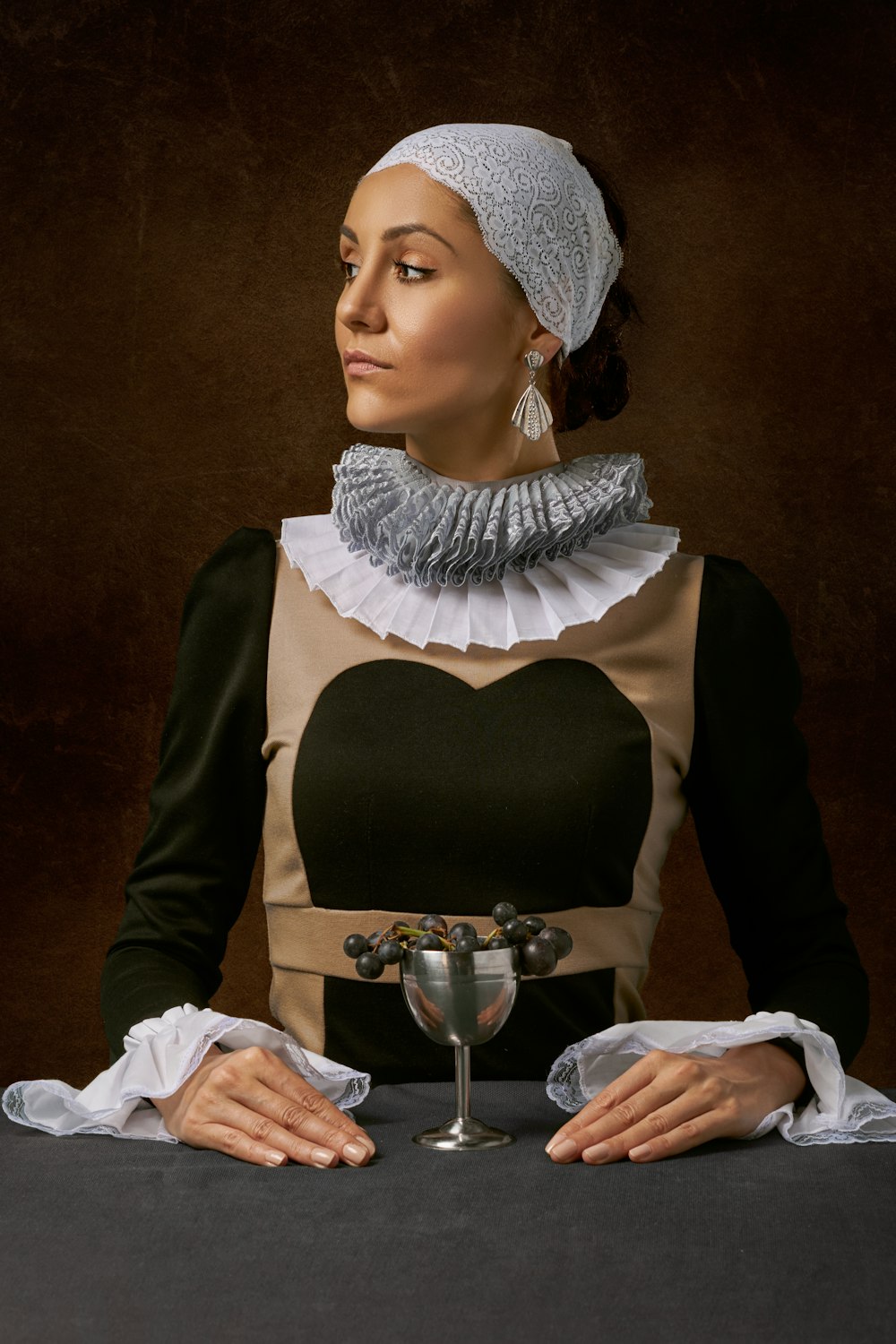 woman in green and white long-sleeved top facing sideways