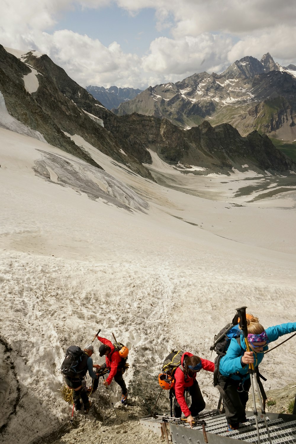 people hiking on mountain during day