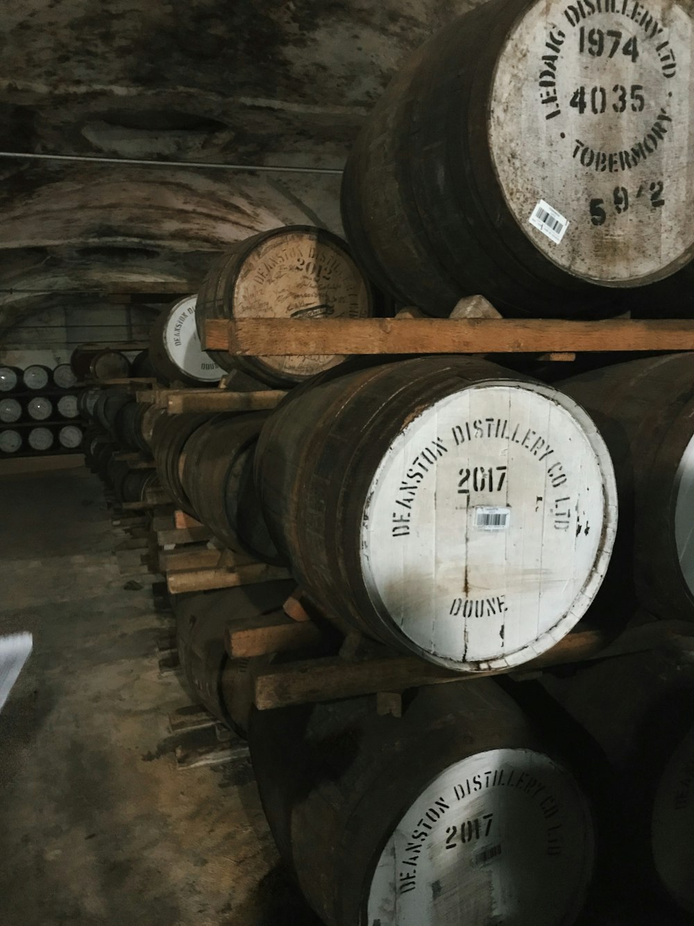 pile of oak barrels inside tunnel