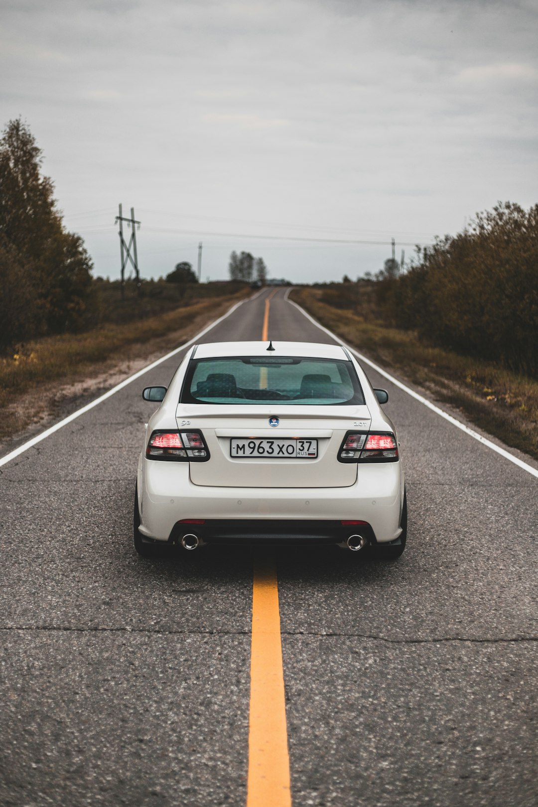 white car on roadway