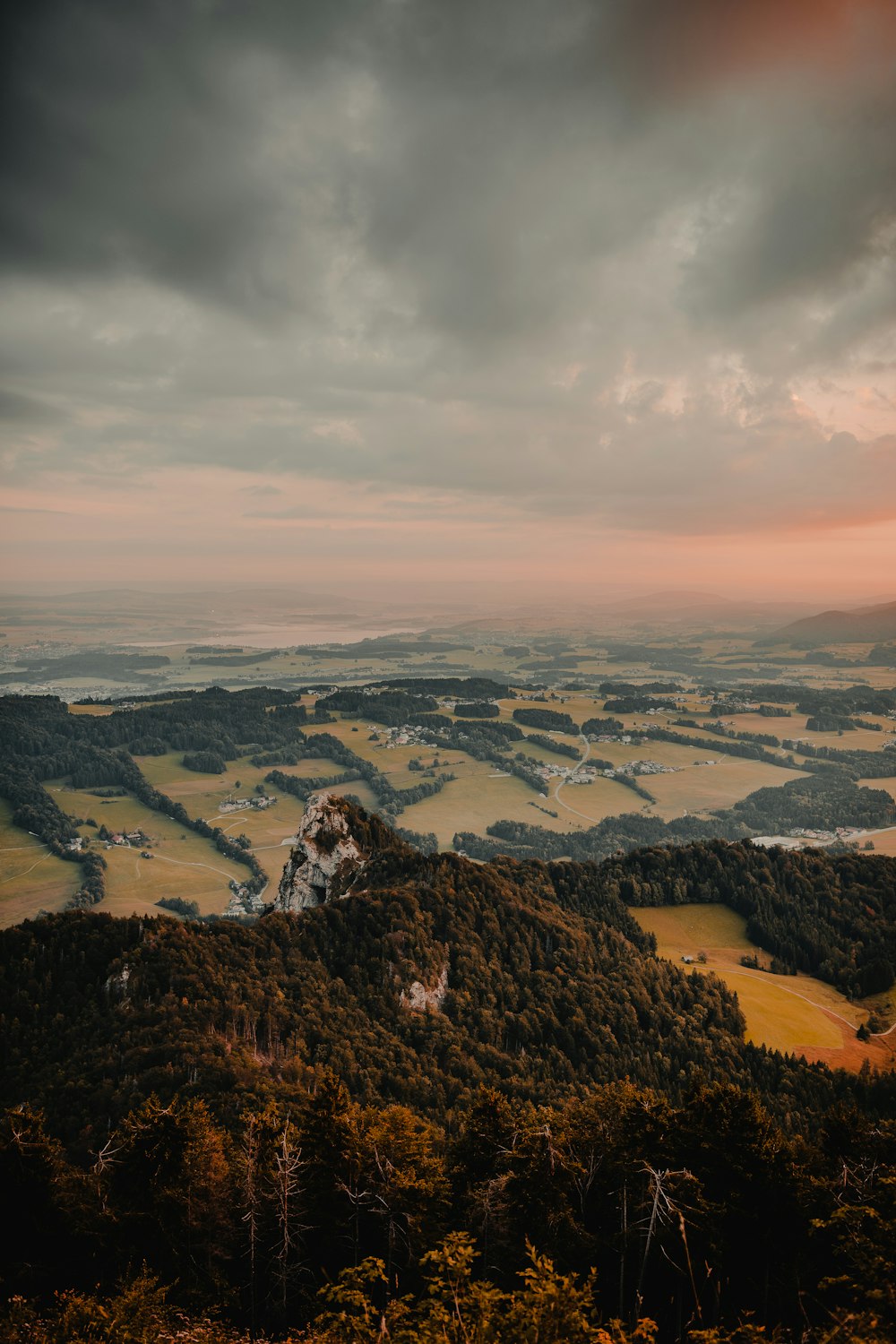 aerial photography of tree covered mountain under gray skies