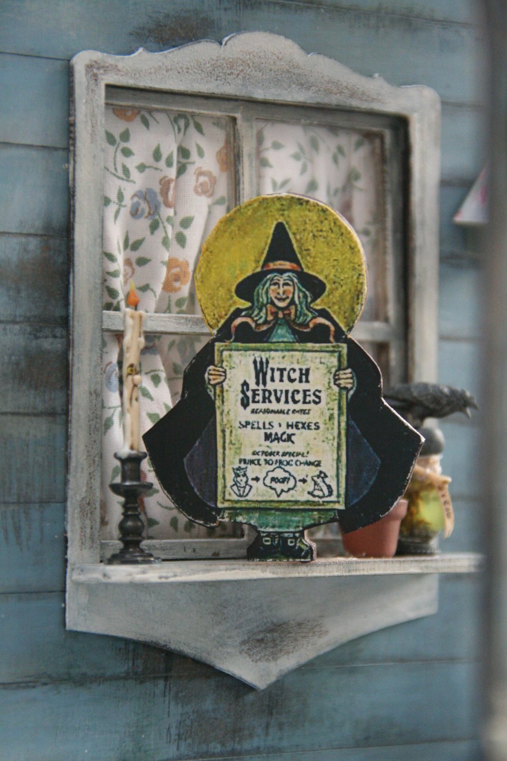 witch services signage on window shelf