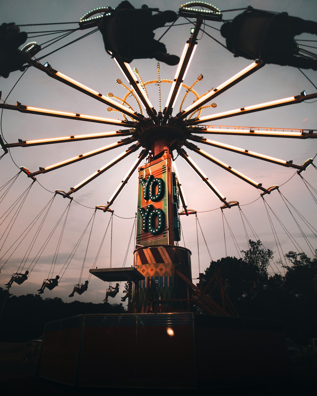 orange and multicolored rotating circus ride