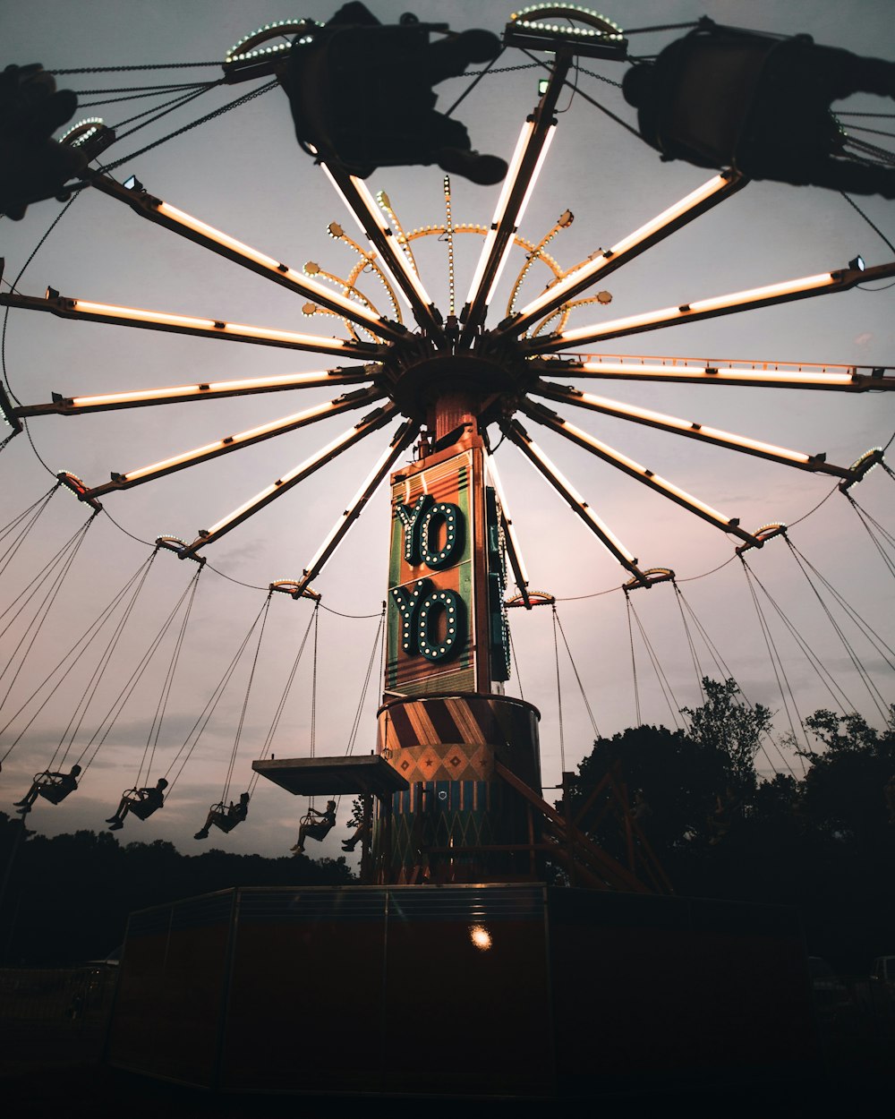 orange and multicolored rotating circus ride