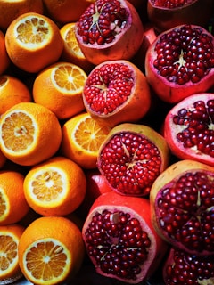 sliced orange and pomegranate fruits