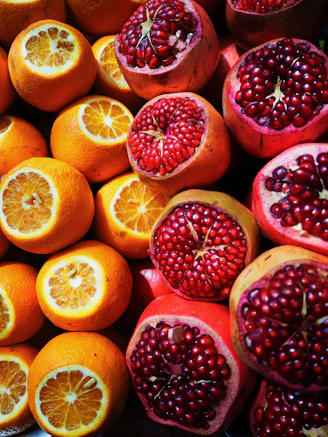 sliced orange and pomegranate fruits