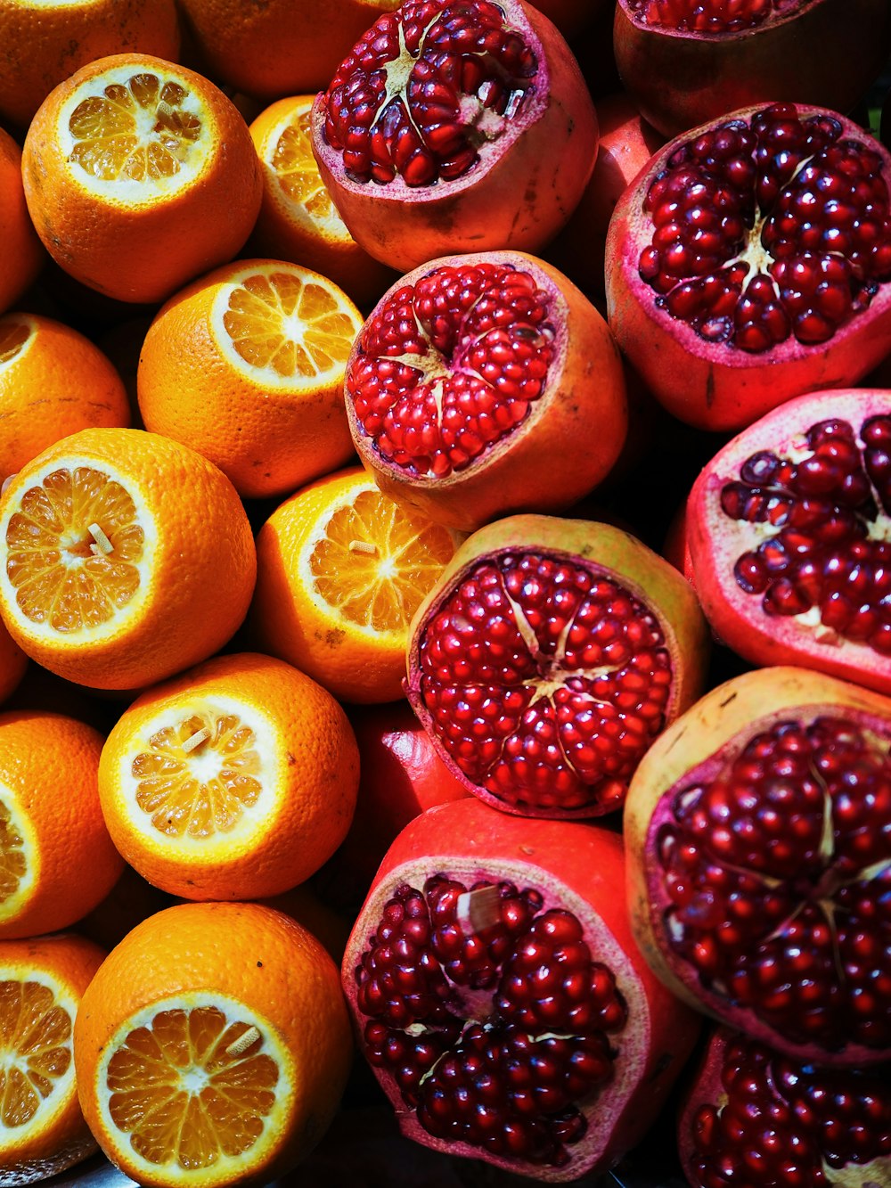 sliced orange and pomegranate fruits