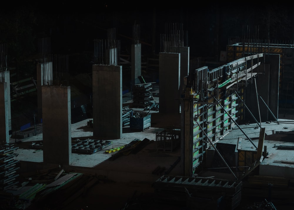 a construction site at night with lots of construction equipment