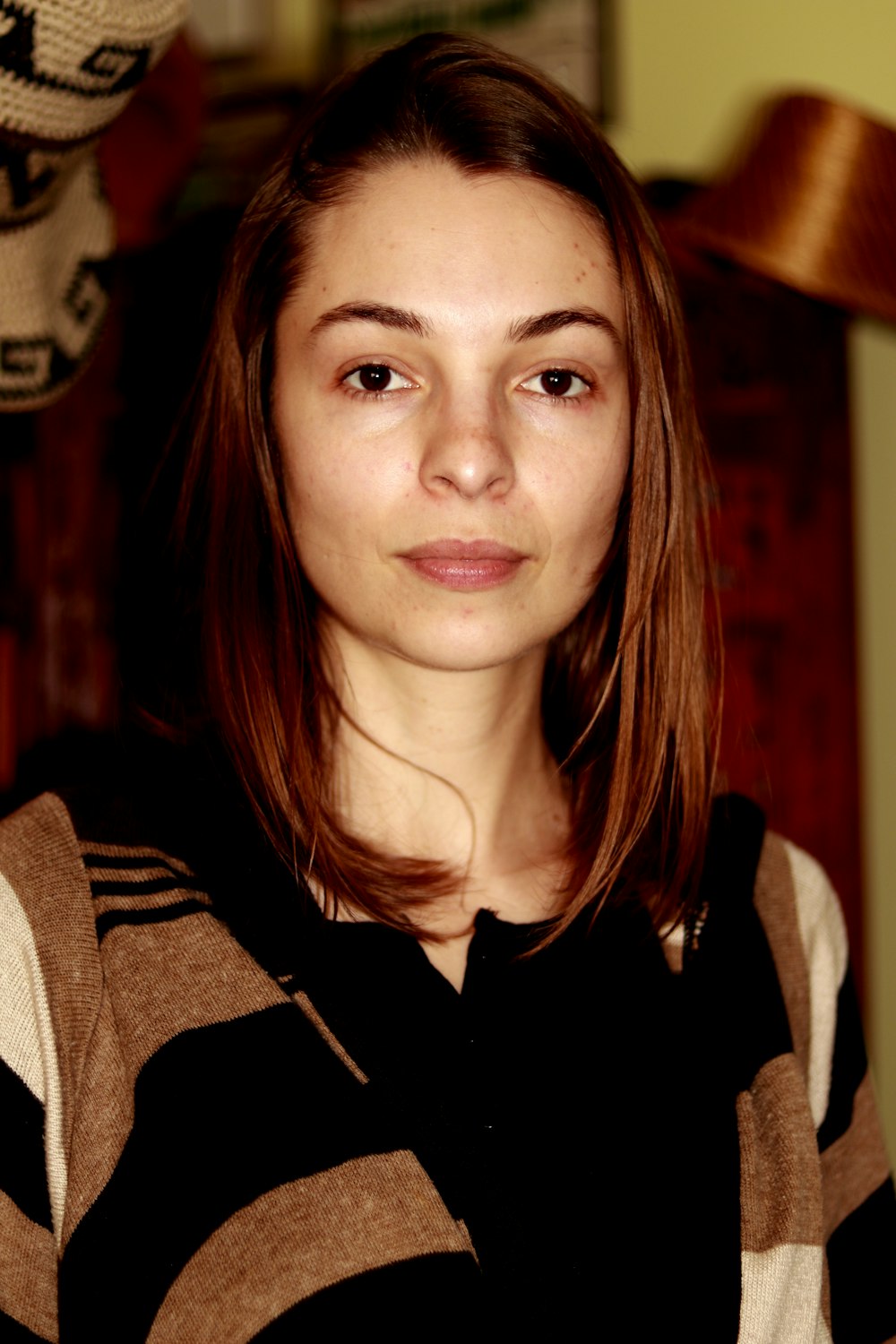 woman wears black and brown dress