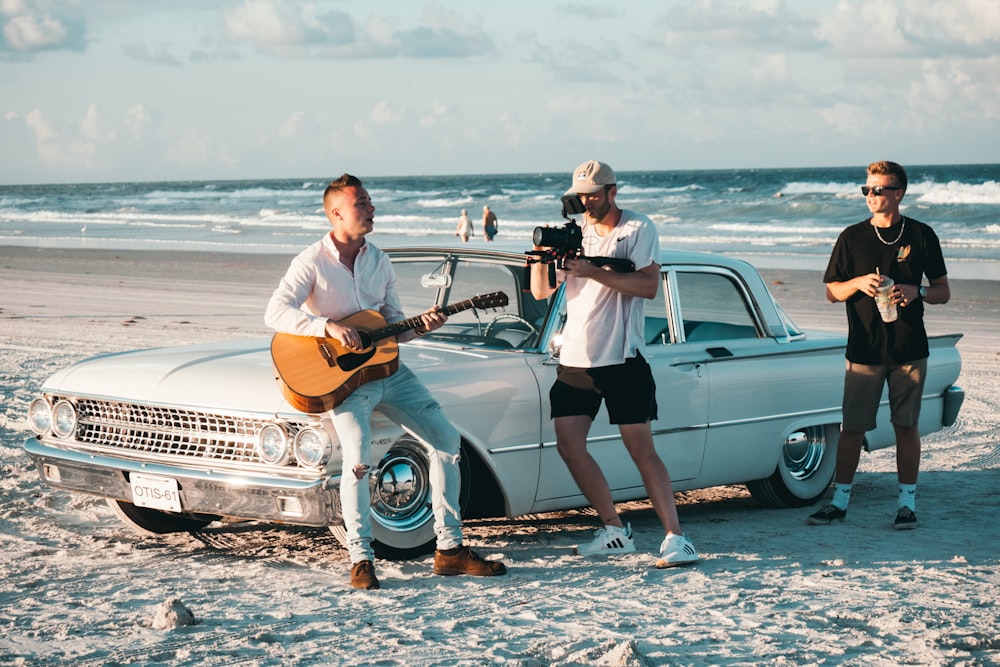 three men by the car