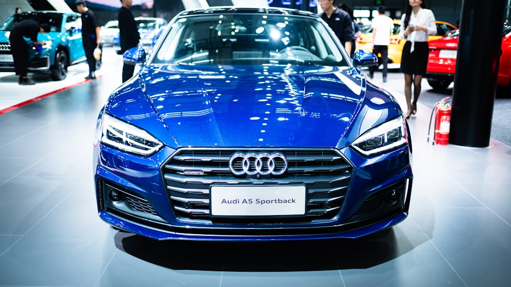 blue Audi car parked indoors