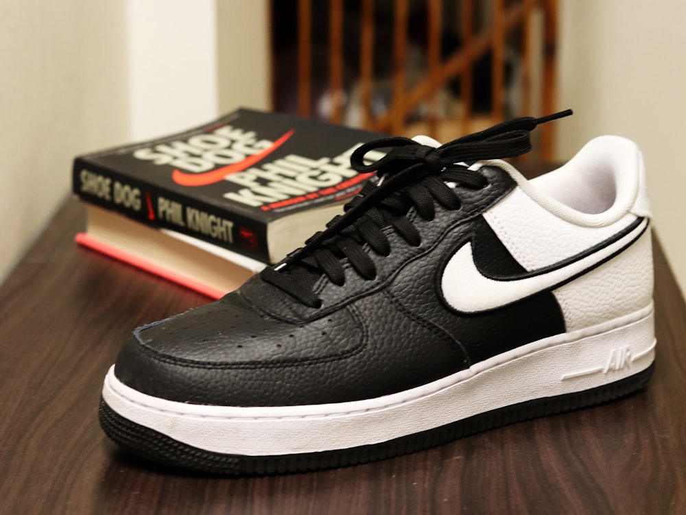 unpaired black and white Nike low-top sneaker