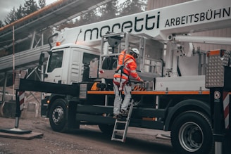 man wears orange reflector vest