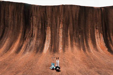two person lying on ground