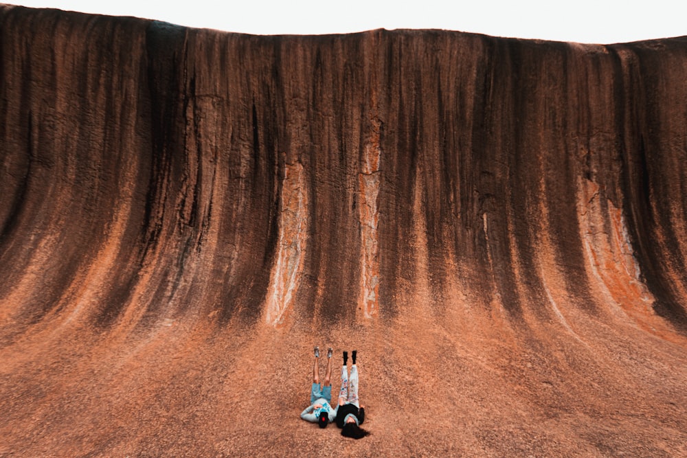 two person lying on ground