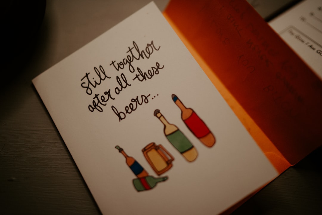 Still Together After All These Beers greeting card on gray surface