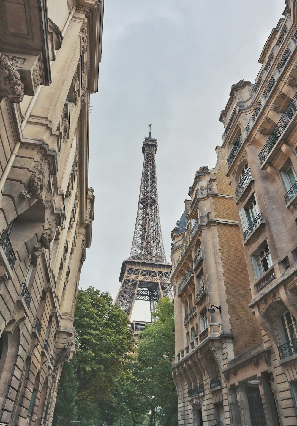 Eiffel tower under cloudy sky