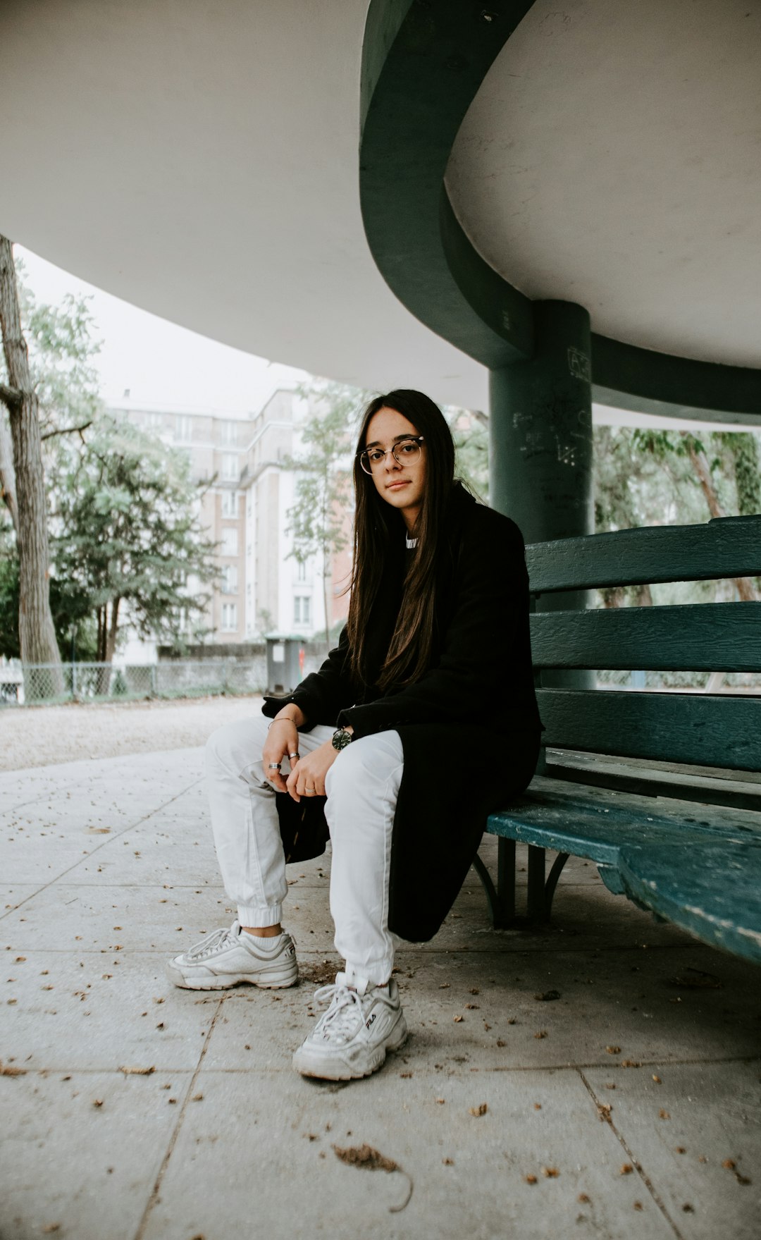 woman sitting on ench