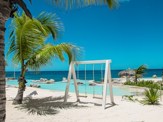 swing bench near swimming pool
