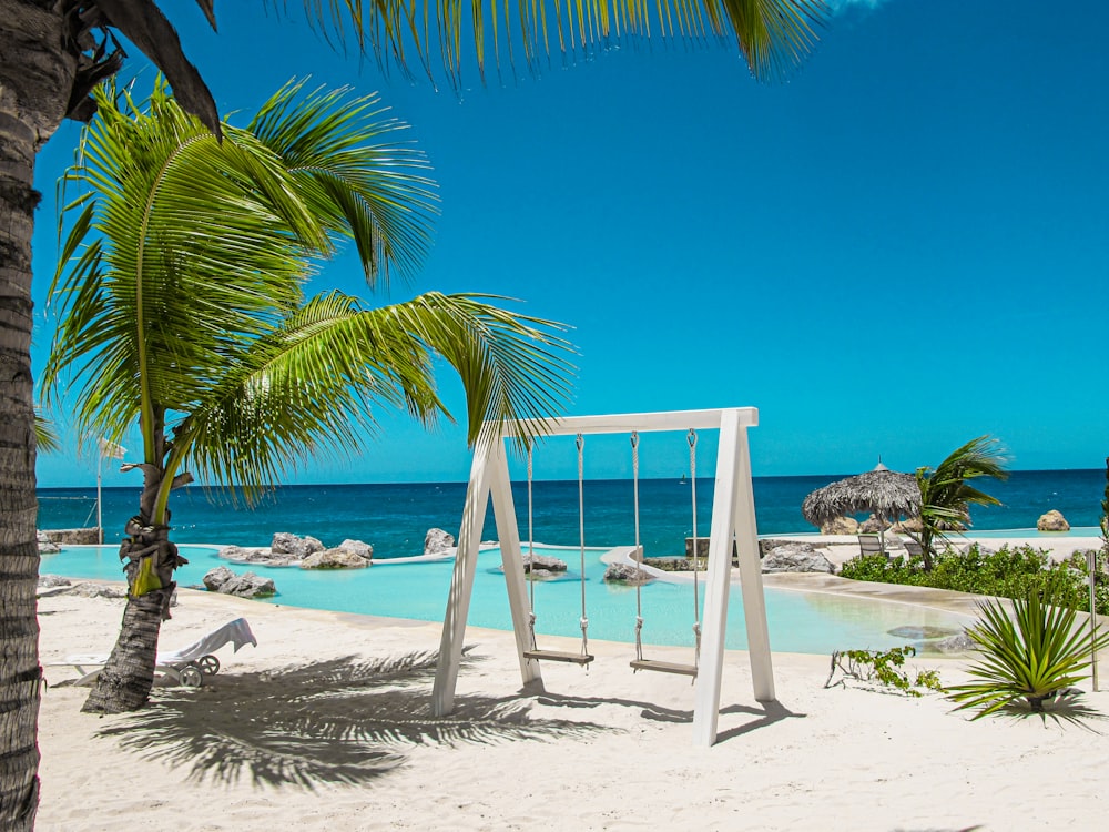 swing bench near swimming pool