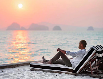 Solo traveler relaxing on a sunny beach after a day of adventure